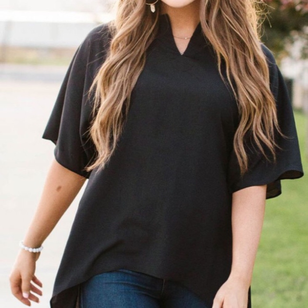 NWOT. A Dip of Darling boutique black hi-lo top.